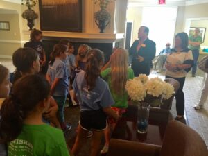 milton addressing girls in lobby (2)