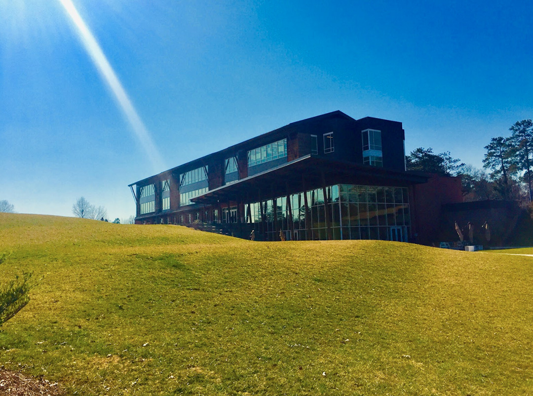 Artistic student photo of Upper Campus building taken from the lawn